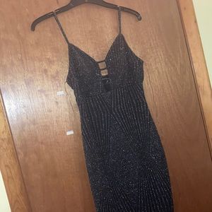 A short black sparkly sexy dress